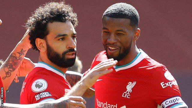 Mohamed Salah (left) celebrates with team-mate Georginio Wijnaldum after scoring against Newcastle United in the Premier League