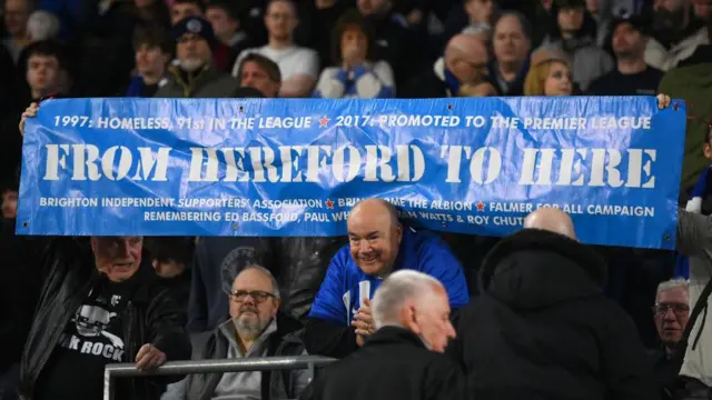 Brighton fans with 'From Hereford to here' sign in the Europa League