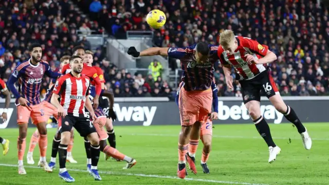 Ben Mee of Brentford scores his team's second goal during the Premier League match between Brentford FC and Nottingham Forest at Gtech Community Stadium on January 20, 2024.