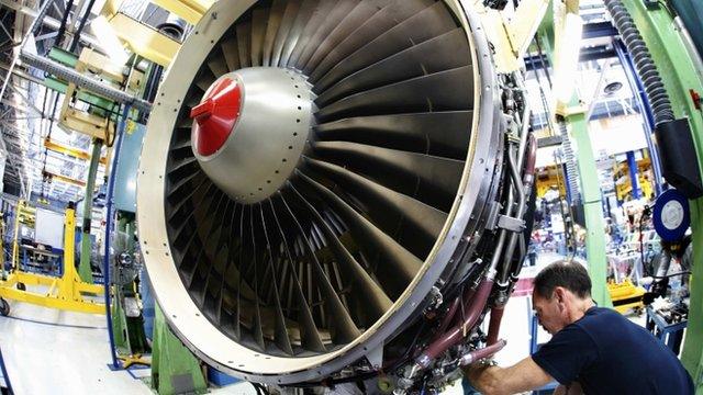 Engineer working on jet engine