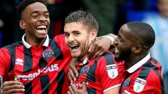 Joe Riley (centre) celebrates scoring for Shrewsbury Town in a League One win at Old Athletic on 3 September 2016