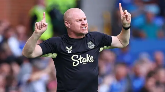 Sean Dyche pointing skywards