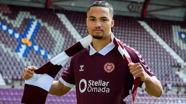 MJ Kamson-Kamara signs for Heart of Midlothian at Tynecastle Park on June 3, 2026 in Edinburgh, Scotland.