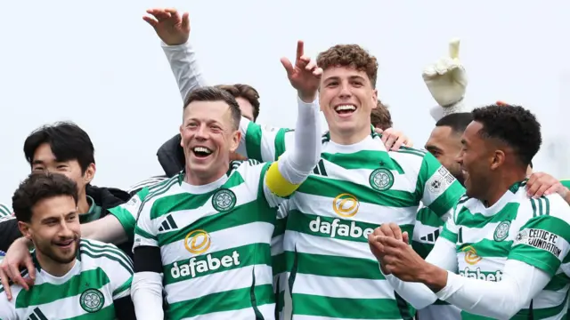 Celtic's Nicolas Kuhn, Callum McGregor, Arne Engels and Auston Trusty celebrate winning the William Hill Premiership Title during a William Hill Premiership match between Dundee Utd and Celtic at the CalForth Construction Arena at Tannadice Park