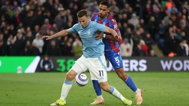 Maxence Lacroix challenges Chris Wood
