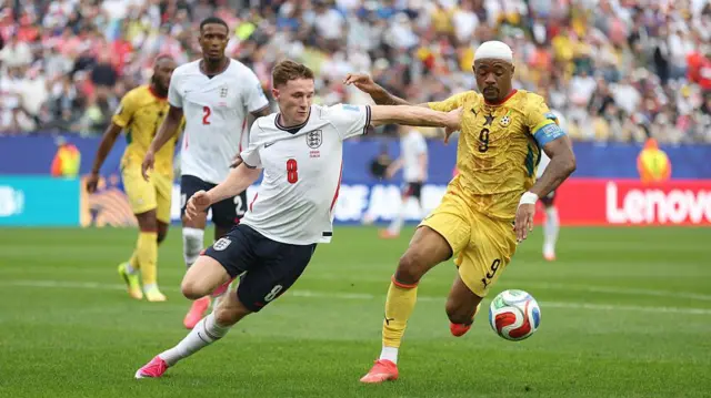 Ghana's Jordan Ayew and England's Elliot Anderson tussle for the ball