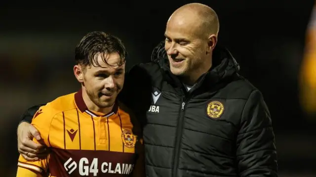 Motherwell midfielder Sam Nicholson celebrates with manager Jens Berthel Askou