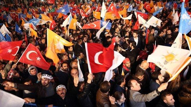 Supporters of Turkey's Justice and Development Party (AKP) celebrate outside the party's headquarters in Ankara