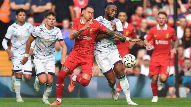 Antoine Semenyo and Darwin Nunez tussle for the ball during Liverpool's Premier League match at home to Brentford