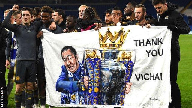 Leicester's players celebrate with fans at the end