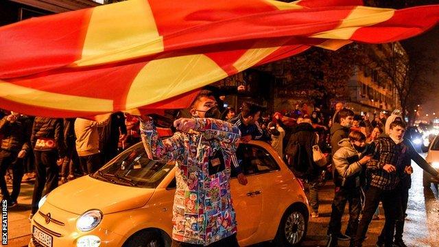 Fans celebrate North Macedonia qualifying for Euro 2020 on the streets of the capital Skopje