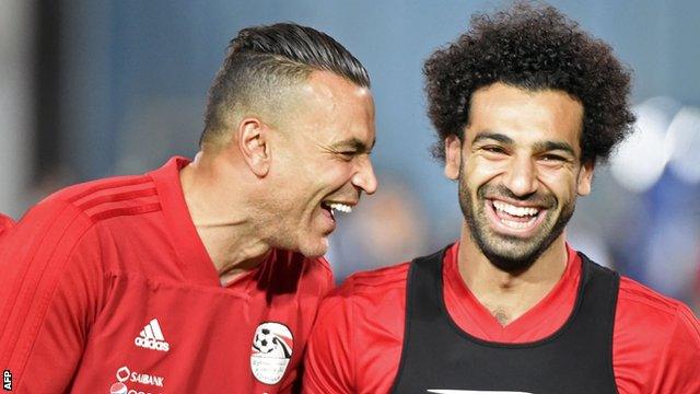 Egypt goalkeeper Essam El-Hadary (left) jokes with forward Mohamed Salah