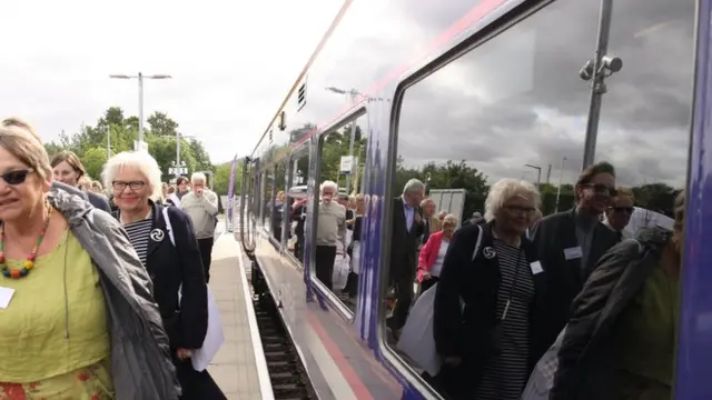 Passengers board the train on the Borders Railway