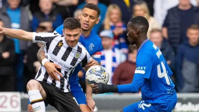 St Mirren's Greg Kiltie against Rangers' James Tavernier and Mohamed Diomande