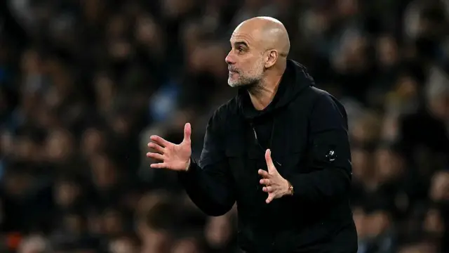 Pep Guardiola reacts on the sidelines