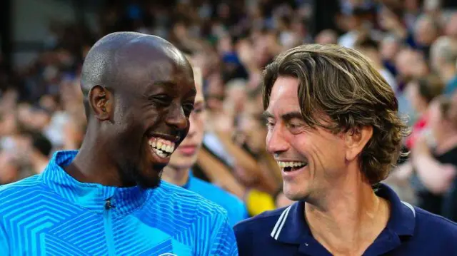Thomas Frank shares a joke with Yoane Wissa