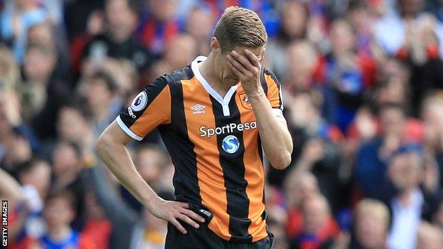 Hull City captain Michael Dawson reacts after his side is relegated to the Championship