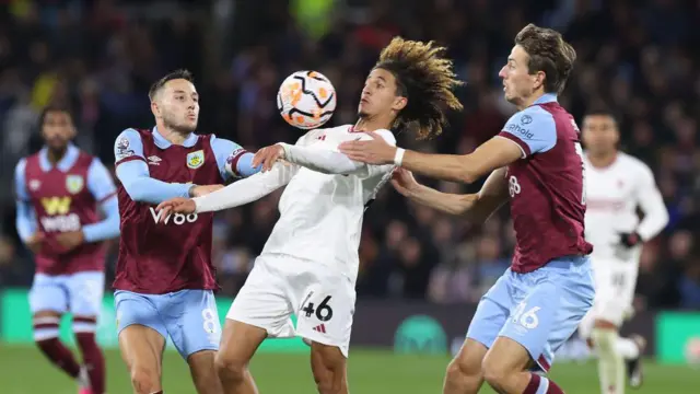 Hannibal Mejbri of Manchester United in action with Josh Brownhill and Sander Berge of Burnley during the Premier League match between Burnley FC and Manchester United at Turf Moor