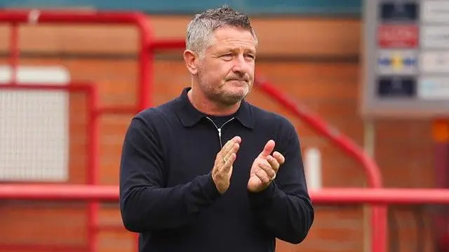 Dundee Manager Tony Docherty applauds fans at full time during a Premier Sports Cup last sixteen match between Dundee and Airdrieonians at The Scot Foam Stadium at Dens Park, on August 17, 2024, in Dundee, Scotland.  (Photo by Ross MacDonald / SNS Group)