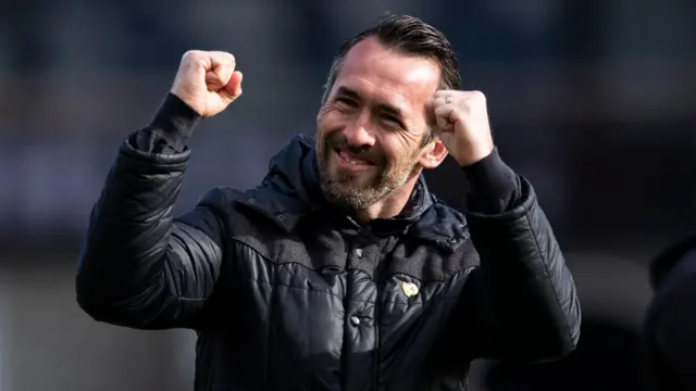 Christian Fuchs celebrates victory for his side over Harrogate Town.