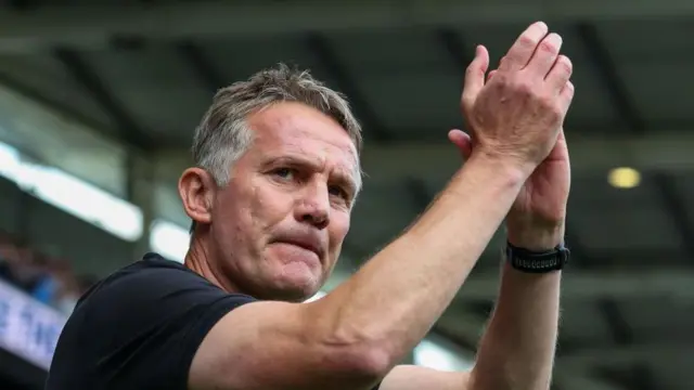 Phil Parkinson applauds supporters