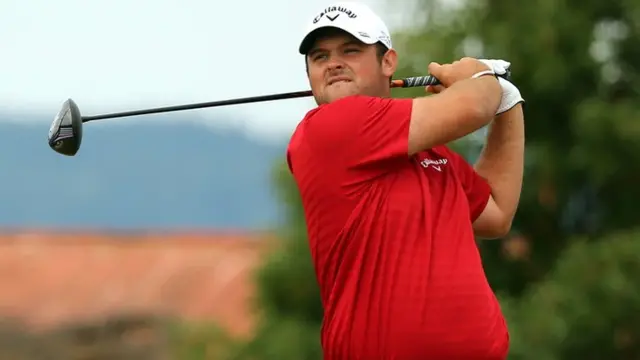 Patrick Reed looks on after his tee shot