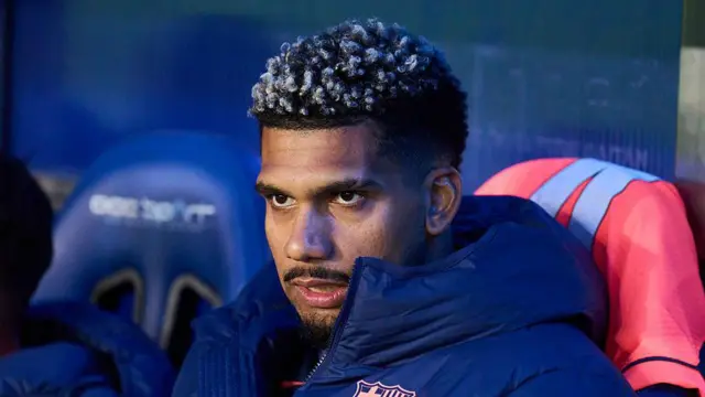 Ronald Araujo looks on