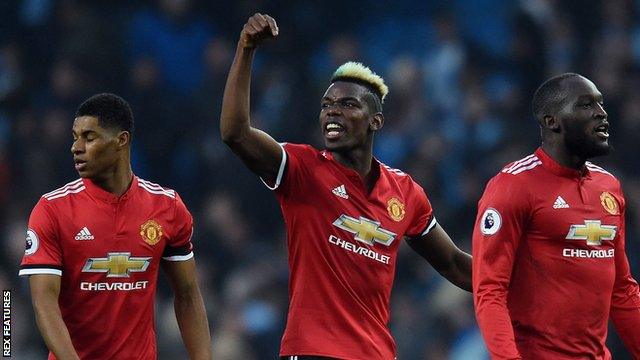 Paul Pogba celebrates Manchester United's win over Manchester City