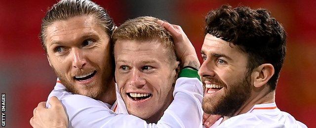 Jeff Hendrick, James McClean and Robbie Brady celebrate McClean's goal in the 1-1 draw against Qatar