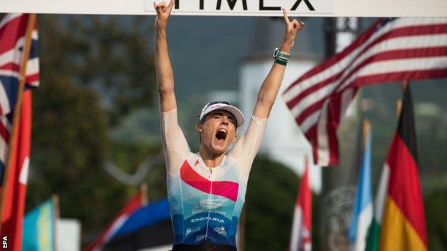 Lucy Charles celebrates on the finish line