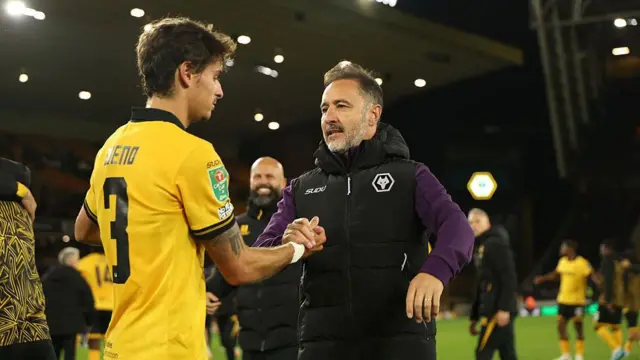 Vitor Pereira embraces Hugo Bueno after full-time