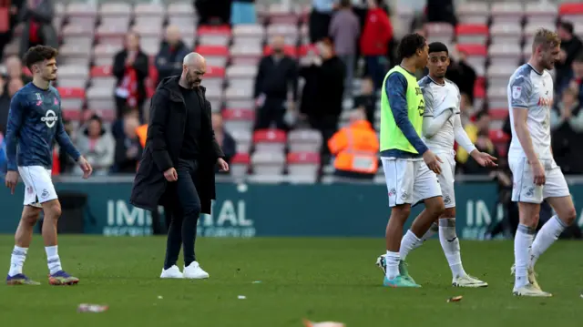 Luke Williams and players trudge off after Swansea's defeat at Middlesbrough