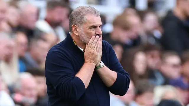 Ange Postecoglou holds his face on the touchline during Forest's defeat at Newcastle