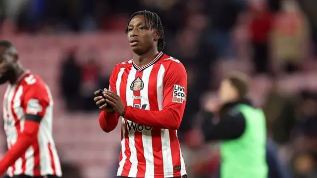 Romaine Mundle applauding