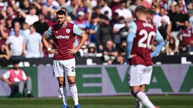 Max Kilman of West Ham United shows dejection after Nicolas Jackson of Chelsea (not pictured) scores his team's first goal during the Premier League match between West Ham United FC and Chelsea FC at London Stadium