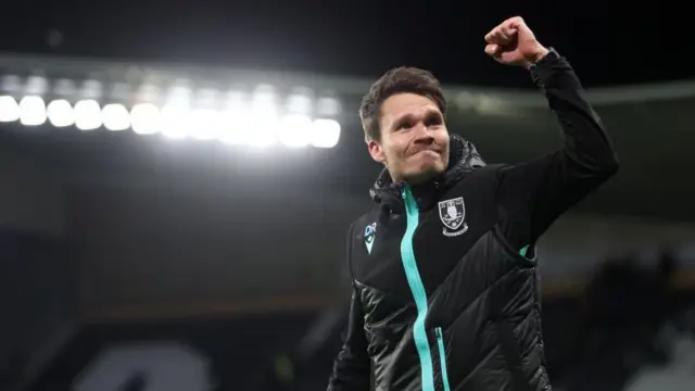 Sheffield Wednesday boss Danny Rohl salutes the crowd after winning at Derby County