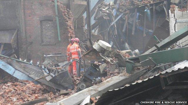 Rescue workers in the rubble