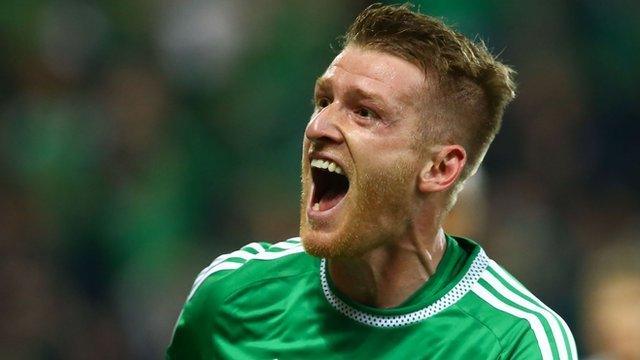 Northern Ireland captain Steven Davis celebrates scoring against Greece at Windsor Park