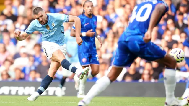 Mateo Kovacic takes a shot at goal for Manchester City