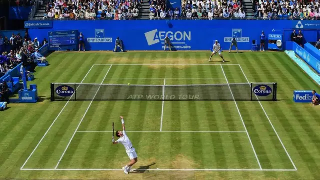 Andy Murray serves at Queens