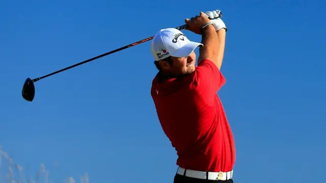 Patrick Reed hits a tee shot