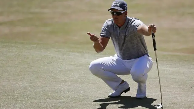 Henrik Stenson lines up a shot