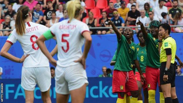 Cameroon players react to a VAR decision