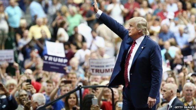 Donald Trump greets supporters at a campaign rally in Dallas