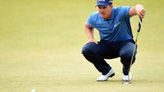 Henrik Stenson lines up his putt