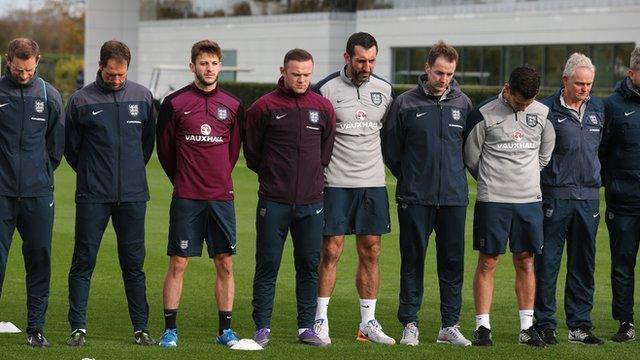 England team pay their respects