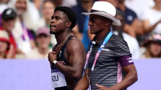 Jeremiah Azu is led away at the Olympic Games in Paris