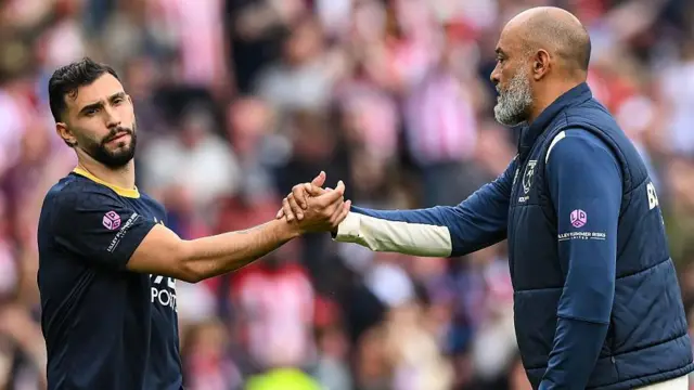 Taty Castellanos of West Ham United shakes hands with Nuno Espirito Santo