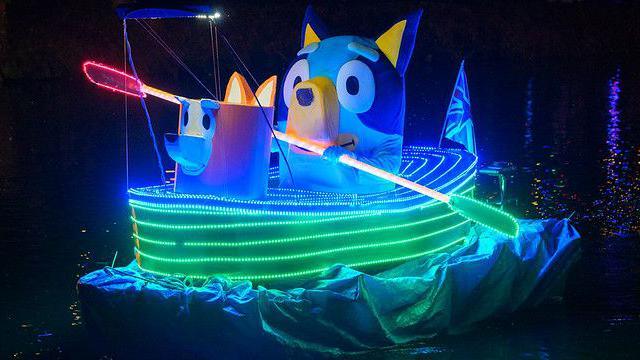 A Bluey boat glowing in the darkness