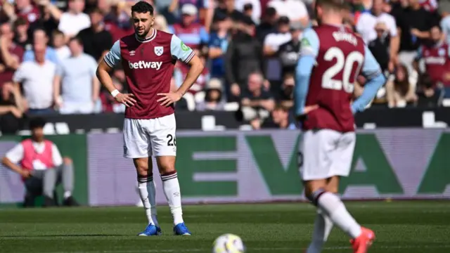 Max Kilman looks on after West Ham United concede against Chelsea.